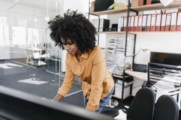 Small business SEO; girl in her office working