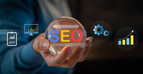 SEO consulting services; a hand holding a sphere with the acronym SEO